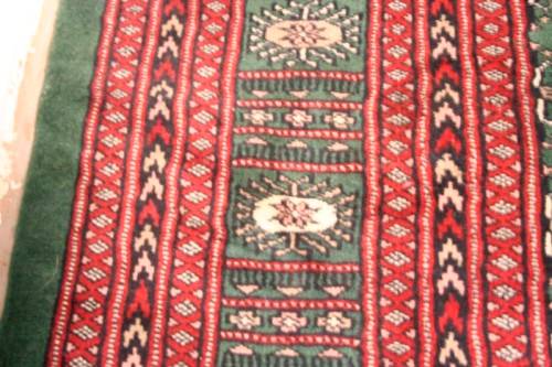 **RS17** A superb (189cm x 289cm long) rare green and red Kashmir Mori Bukhara Persian carpet