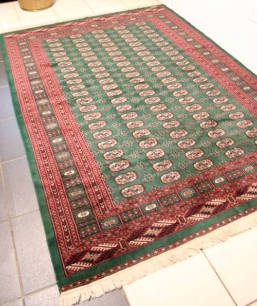 **RS17** A superb (189cm x 289cm long) rare green and red Kashmir Mori Bukhara Persian carpet