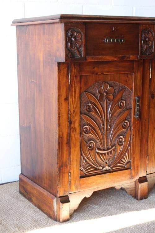 A gorgeous Victorian heavily carved solid Oak three-door side server with loads of drawer space!