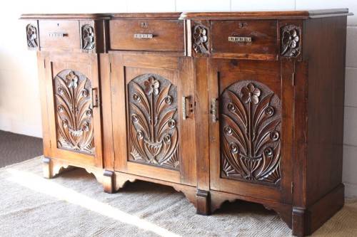 A gorgeous Victorian heavily carved solid Oak three-door side server with loads of drawer space!