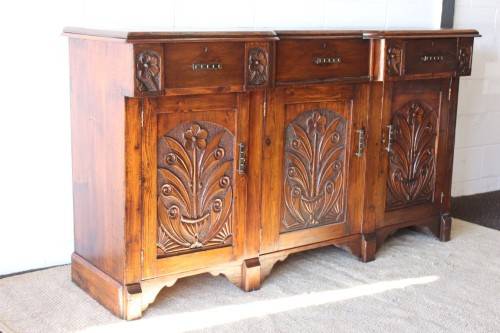 A gorgeous Victorian heavily carved solid Oak three-door side server with loads of drawer space!