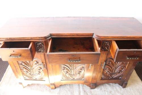 A gorgeous Victorian heavily carved solid Oak three-door side server with loads of drawer space!