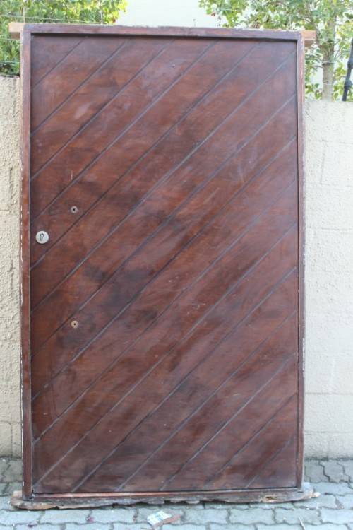 A stunning large 119cm x 202.5cm solid Sapele Wood diagonal pivot slatted front door-Lifespace Sale