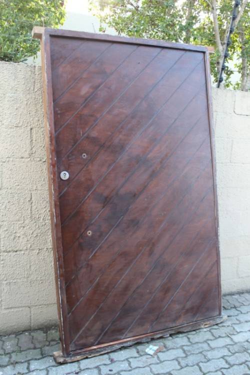A stunning large 119cm x 202.5cm solid Sapele Wood diagonal pivot slatted front door-Lifespace Sale