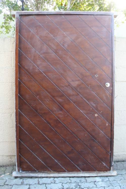 A stunning large 119cm x 202.5cm solid Sapele Wood diagonal pivot slatted front door-Lifespace Sale