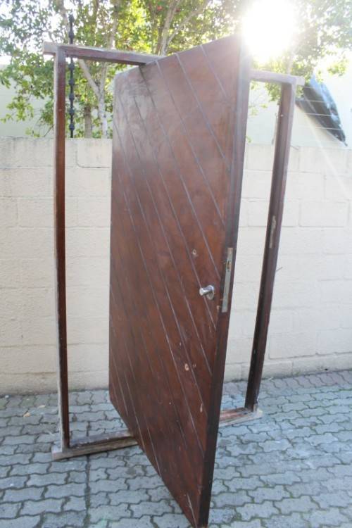 A stunning large 119cm x 202.5cm solid Sapele Wood diagonal pivot slatted front door-Lifespace Sale