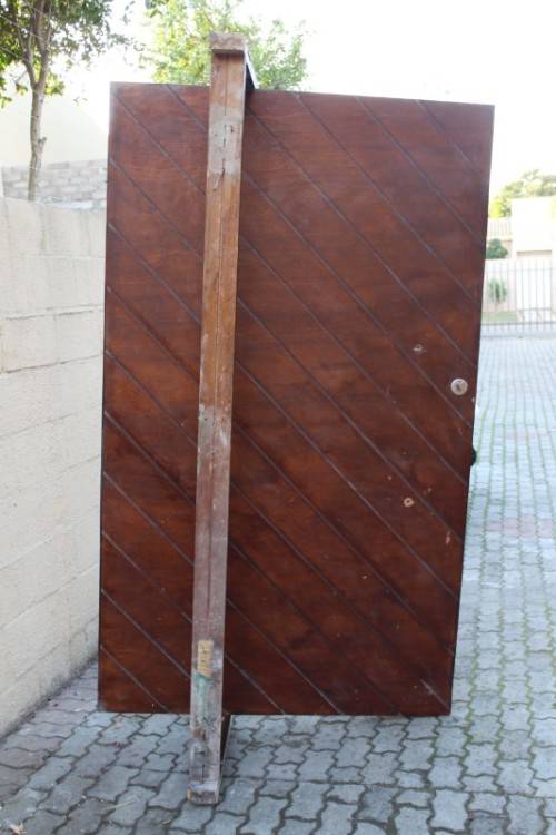 A stunning large 119cm x 202.5cm solid Sapele Wood diagonal pivot slatted front door-Lifespace Sale