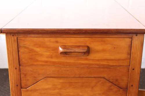 A stunning & unusual vintage oak drop-leaf dining table with a cupboard and three storage drawers