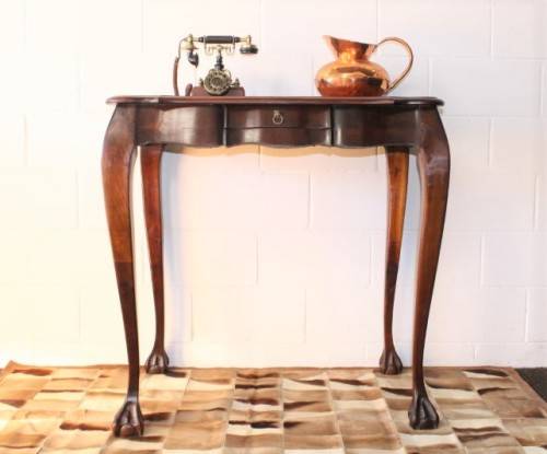 A beautiful tall (91cm) antique solid stink-wood & yellow-wood ball and claw hall table w/ a drawer