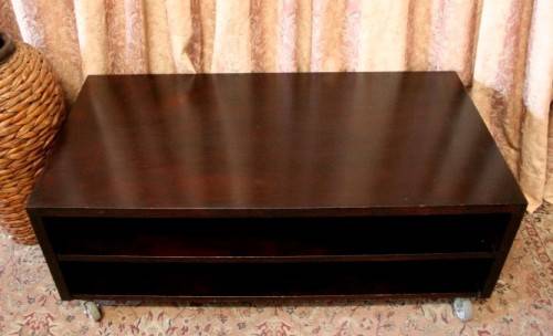 A stunning stylish wooden TV stand on wheels with place for your entertainment centre