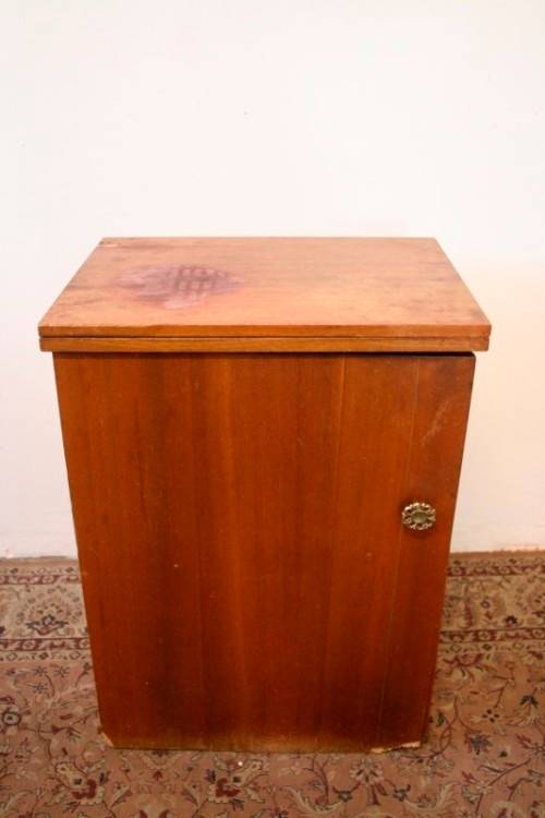 A vintage Empisal deluxe electric sewing machine in its original cabinet w/ accessories, working.