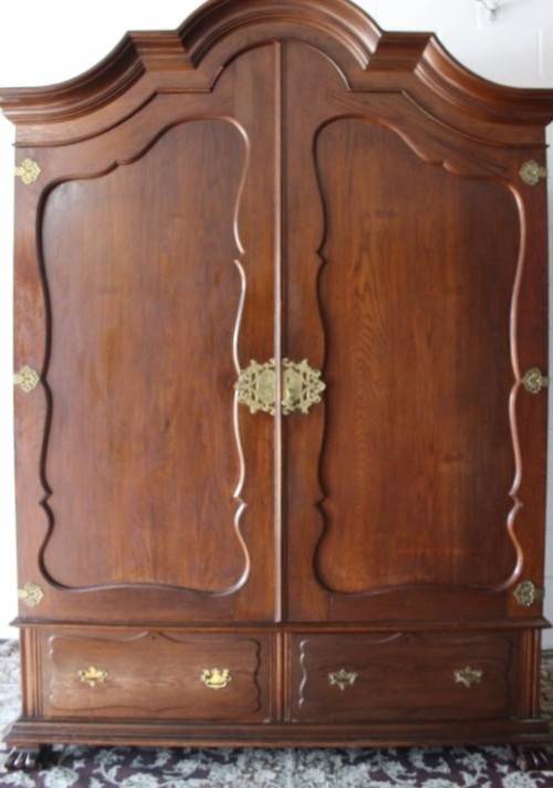 An impressive antique solid honeyed oak gabled double-door wardrobe w drawers & brass embellishments
