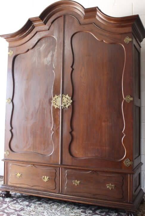 An impressive antique solid honeyed oak gabled double-door wardrobe w drawers & brass embellishments
