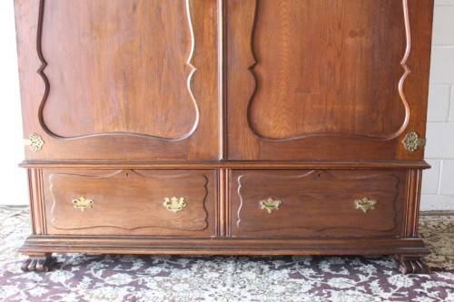 An impressive antique solid honeyed oak gabled double-door wardrobe w drawers & brass embellishments