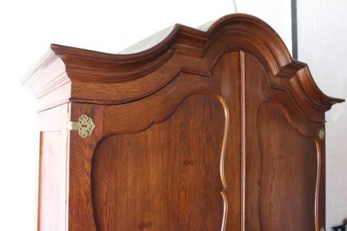 An impressive antique solid honeyed oak gabled double-door wardrobe w drawers & brass embellishments