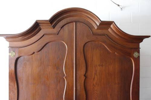 An impressive antique solid honeyed oak gabled double-door wardrobe w drawers & brass embellishments