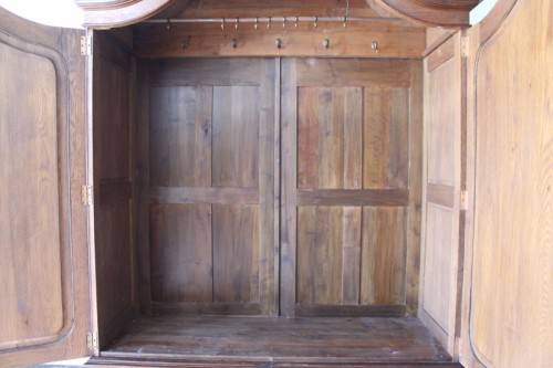 An impressive antique solid honeyed oak gabled double-door wardrobe w drawers & brass embellishments
