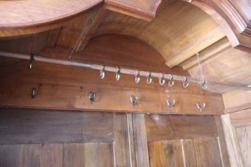 An impressive antique solid honeyed oak gabled double-door wardrobe w drawers & brass embellishments