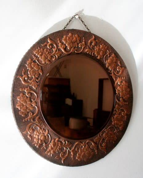 A superb antique ornately moulded copper framed round pink bevelled glass wall mirror - wow!!