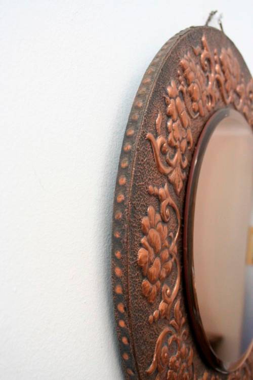 A superb antique ornately moulded copper framed round pink bevelled glass wall mirror - wow!!