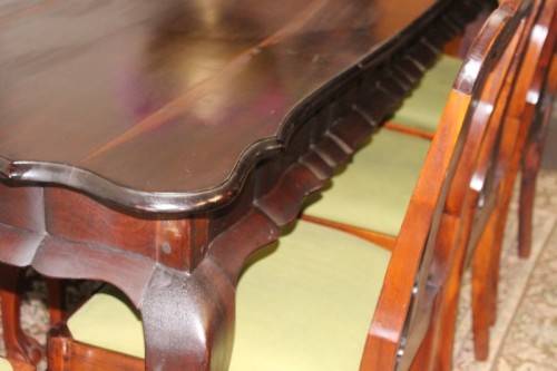 A solid blackwood scalloped edge ball & claw 8-seater dining suite with a separate cutlery table