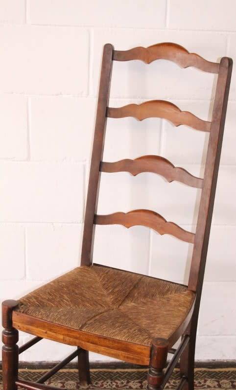 **RS17** A wonderful antique oak ladder-back dining/ occasional chair with a woven grass seat