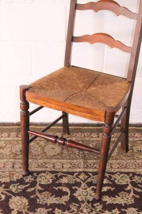 **RS17** A wonderful antique oak ladder-back dining/ occasional chair with a woven grass seat