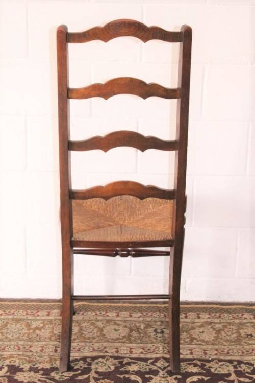 **RS17** A wonderful antique oak ladder-back dining/ occasional chair with a woven grass seat