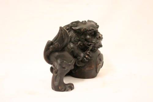 An awesome black oriental resin foo dog/ temple lion ornament
