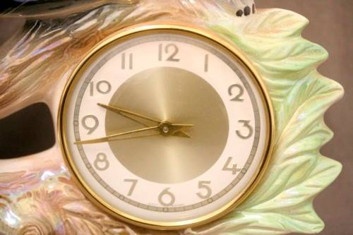 A gorgeous, decorative German made porcelain Jaguar wind up clock.