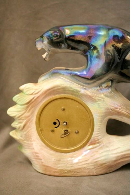 A gorgeous, decorative German made porcelain Jaguar wind up clock.