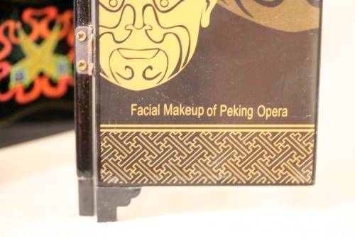 A stunning six-panel black lacquer ornamental divider depicting the "facial make up of Peking Opera"