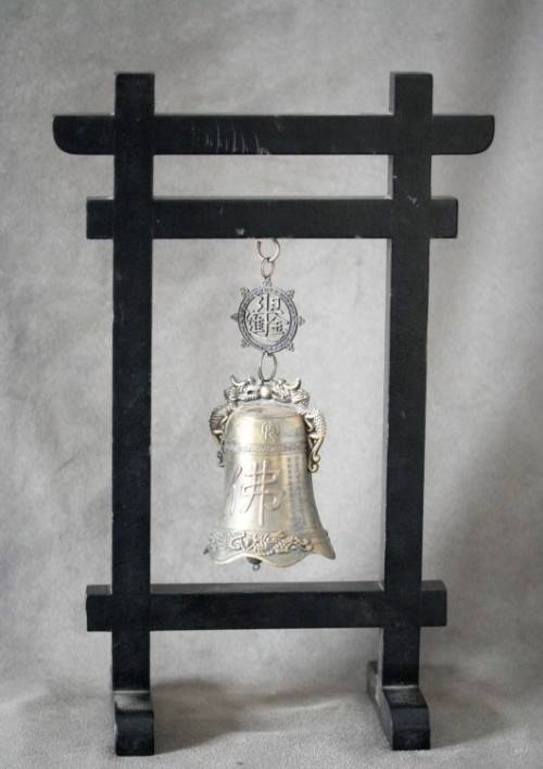 An amazing vintage Chinese bell on a wood stand with lovely detailing.