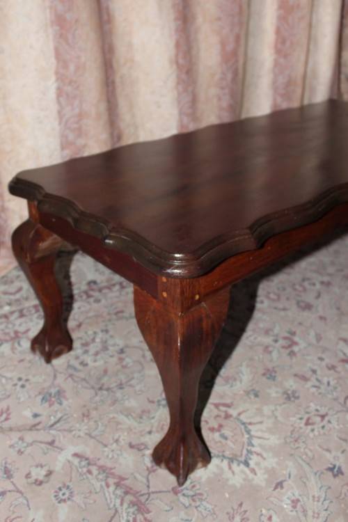 A lovely vintage scalloped edge solid Imbuia wood ball and claw coffee/ side table