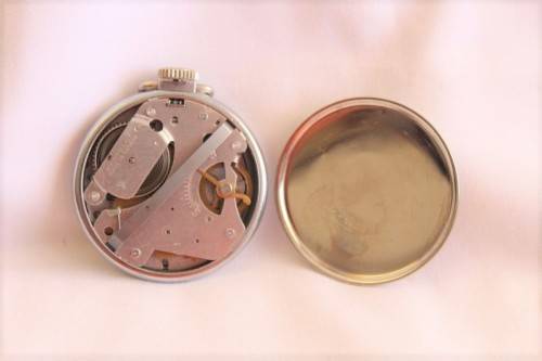 A gorgeous antique Canadian made Westclox Zobo chrome plated open-face pocket watch with a fob chain