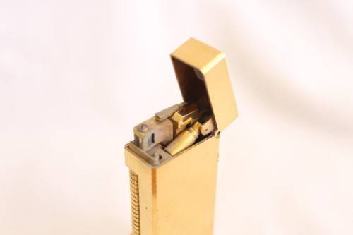 A beautiful vintage (c1972) gold plated Dunhill Rollagas lighter in its box in working condition
