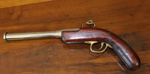 A fantastic wood with brass & metal embellishments vintage powder pistol. Awesome display piece!!!