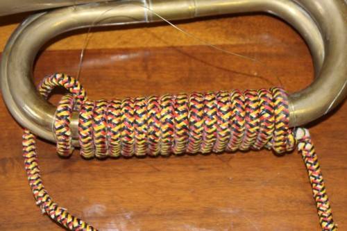 A fabulous vintage brass military bugle with colourful rope & tassel.  Lifespace Sale