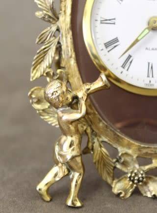 A beautiful vintage Japanese brass "Landex" wind up alarm clock with cherubs.  Lifespace Sale