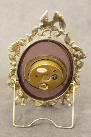 A beautiful vintage Japanese brass "Landex" wind up alarm clock with cherubs.  Lifespace Sale