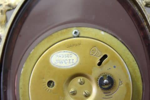 A beautiful vintage Japanese brass "Landex" wind up alarm clock with cherubs.  Lifespace Sale