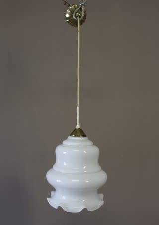 A beautiful white glass single pendant ceiling light, perfect in formal rooms.