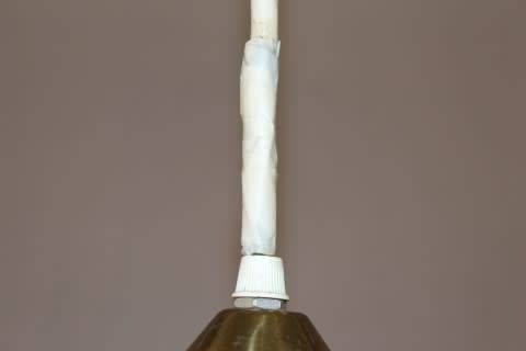 A beautiful white glass single pendant ceiling light, perfect in formal rooms.