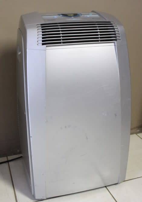 A fantastic De Longhi Pinguino PAC C110 portable air conditioner in full working order.
