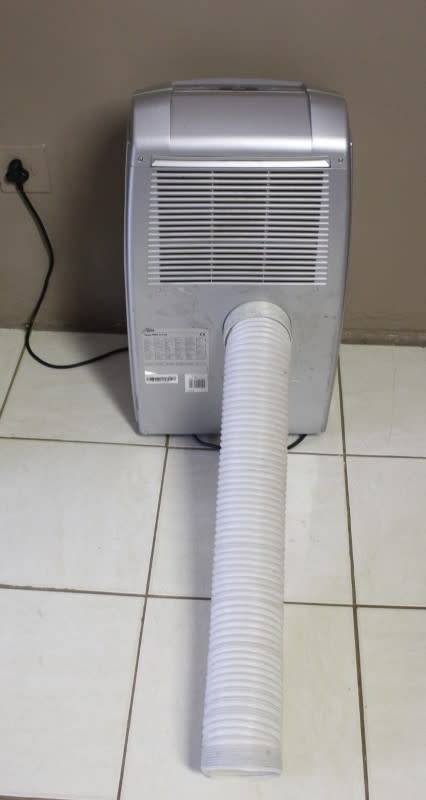 A fantastic De Longhi Pinguino PAC C110 portable air conditioner in full working order.
