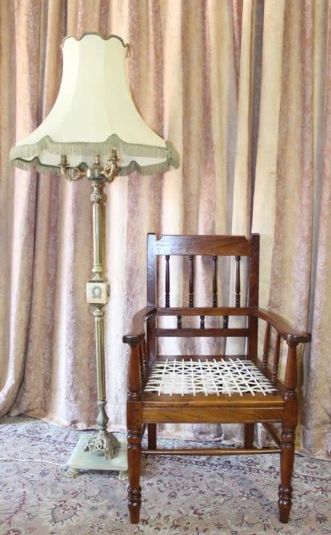 A beautifully made solid Kiaat wood armchair/ carver chair w/ a riempie seat.