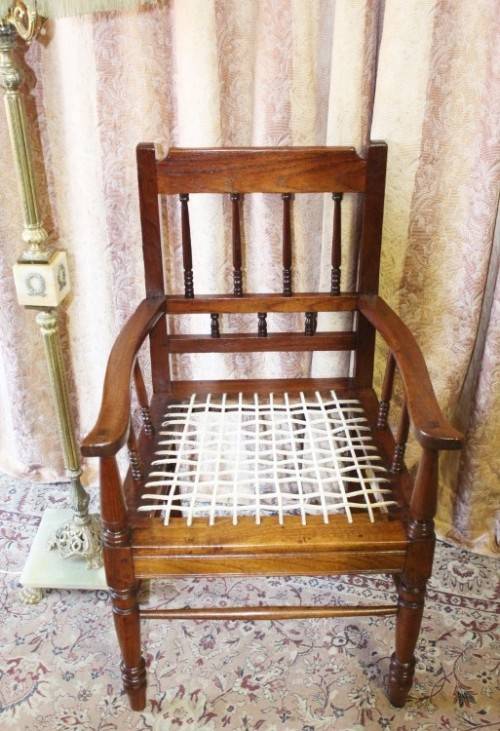 A beautifully made solid Kiaat wood armchair/ carver chair w/ a riempie seat.