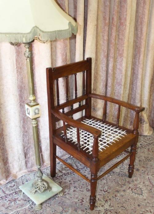 A beautifully made solid Kiaat wood armchair/ carver chair w/ a riempie seat.