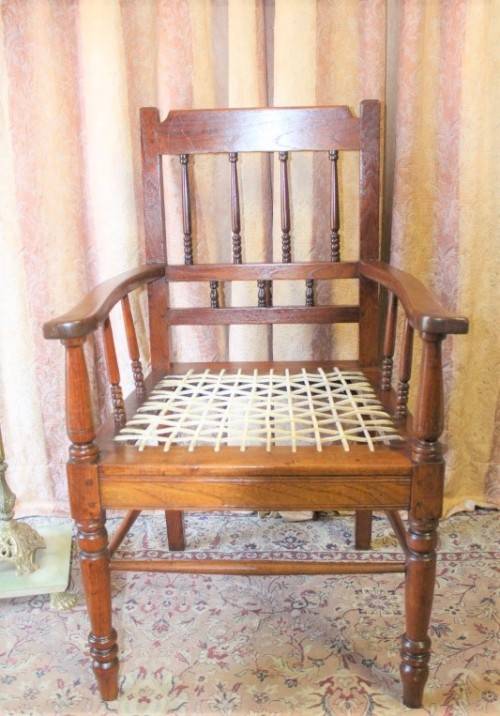 A beautifully made solid Kiaat wood armchair/ carver chair w/ a riempie seat.