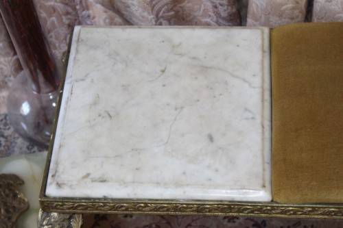 A lovely vintage marble and brass telephone table w/ a cushion, great in informal rooms!